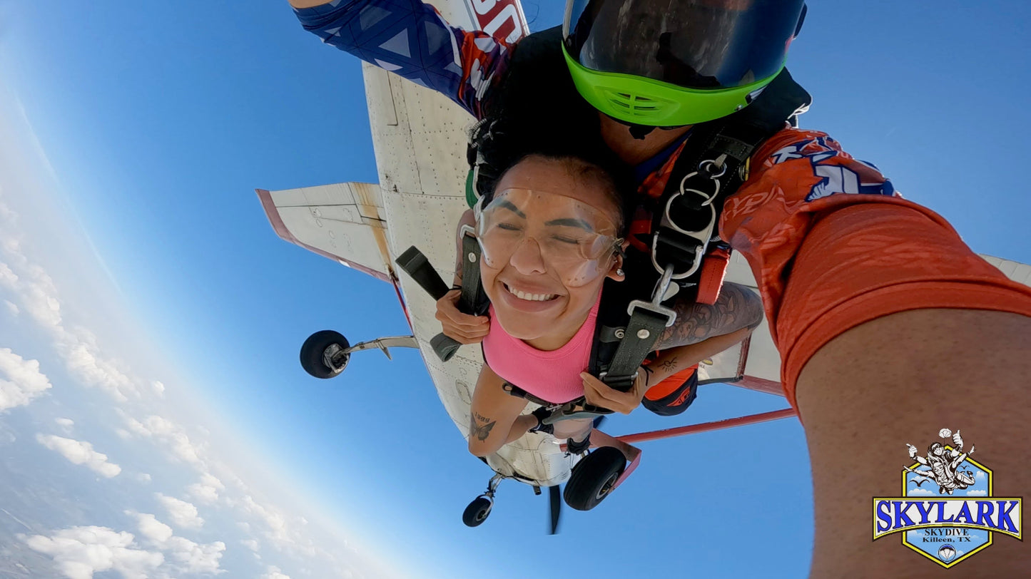 Thrilling tandem skydive exit captured with the aircraft still in view.